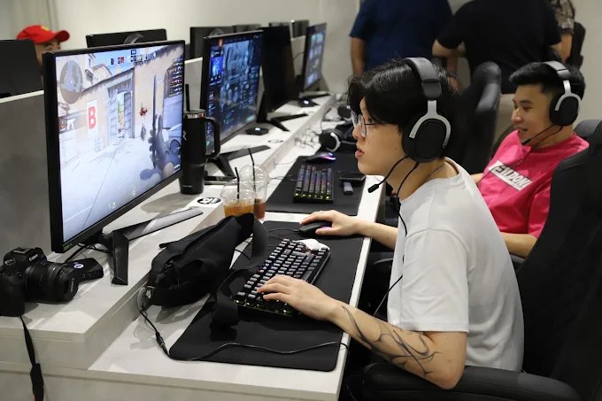 Players in headsets gaming at Standard zone PCs